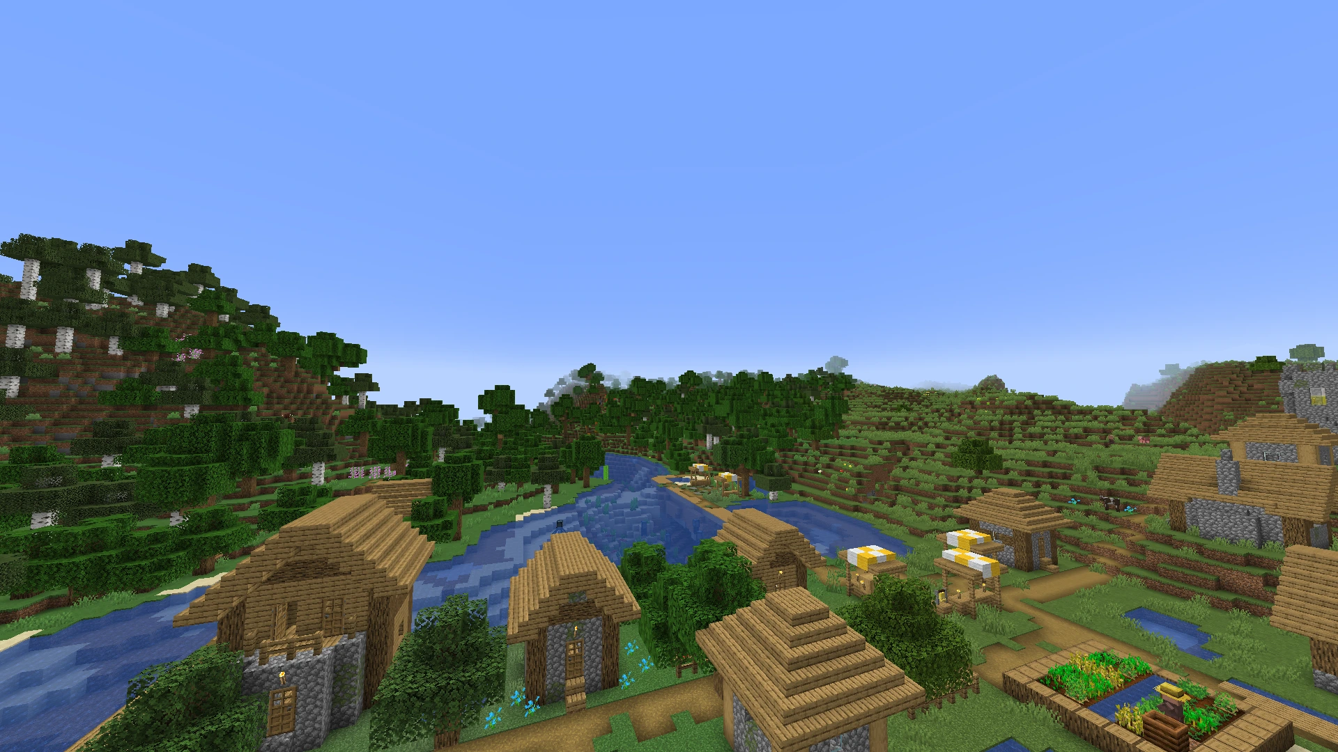 Bird's-eye of a Minecraft village with a lake and a forest in the background