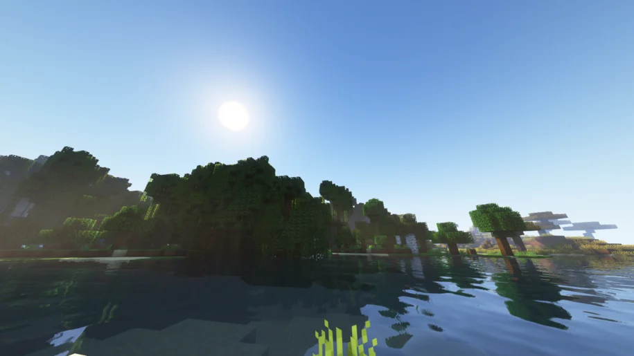Minecraft river with a forest in the background with Complementary Shaders